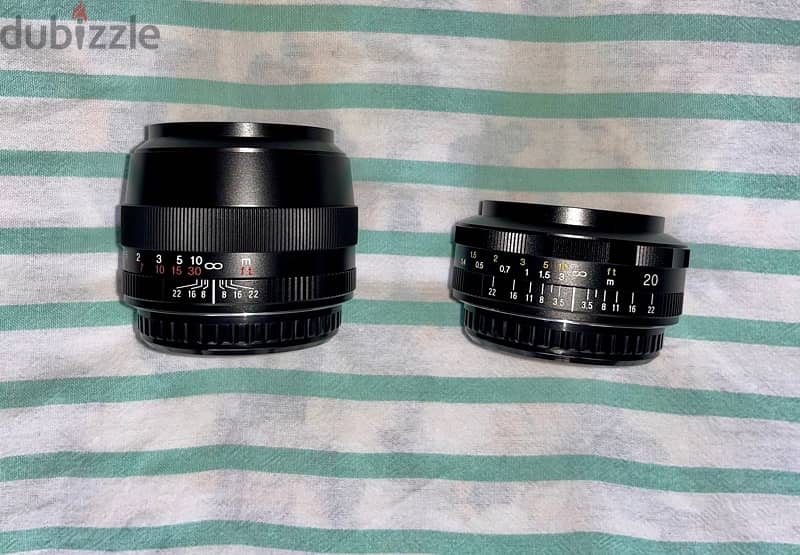 Two Canon EF mount manual focus Voigtlander lenses. 1