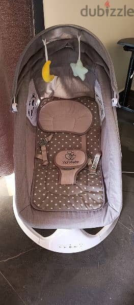 electric baby bouncer + baby bassinet (next to me) + baby bath 3