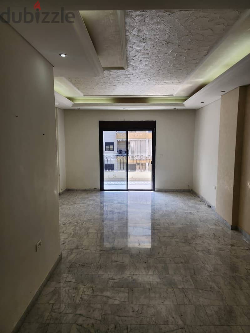 Unfurnished 2-Bedroom Apartment for Rent in New Rawda 0